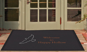 Happy Hollow welcome mat with logo