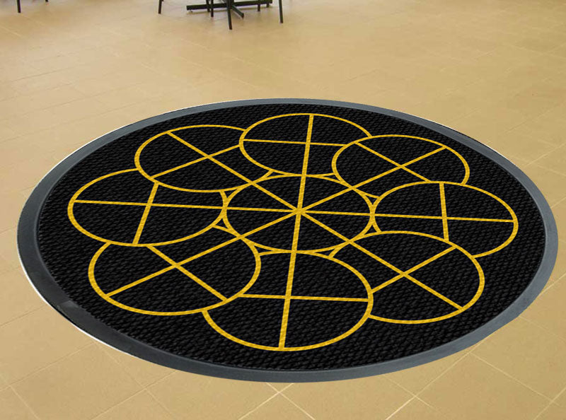 Round black carpet with gold logo. §