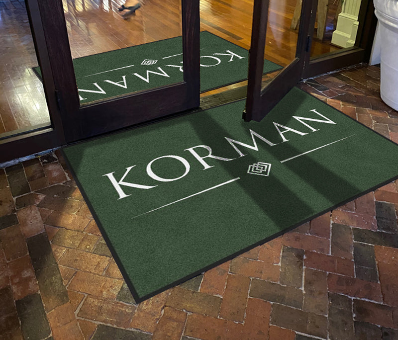 Korman New Logo §